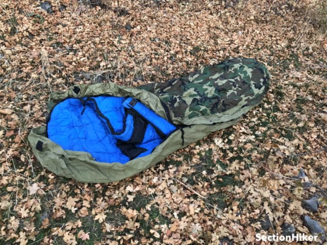 This Military gortex bivy with an early holofil sleeping bag keeps you dry and warm but not much room for gear when used alone