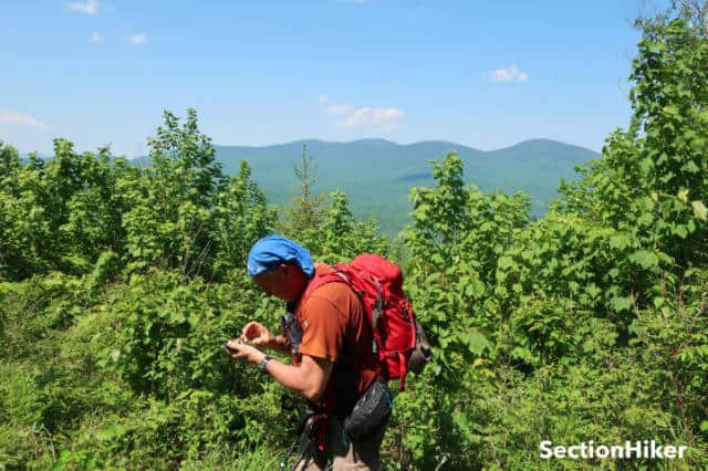 Ken checks our bearing with views of the Weeks on the horizon